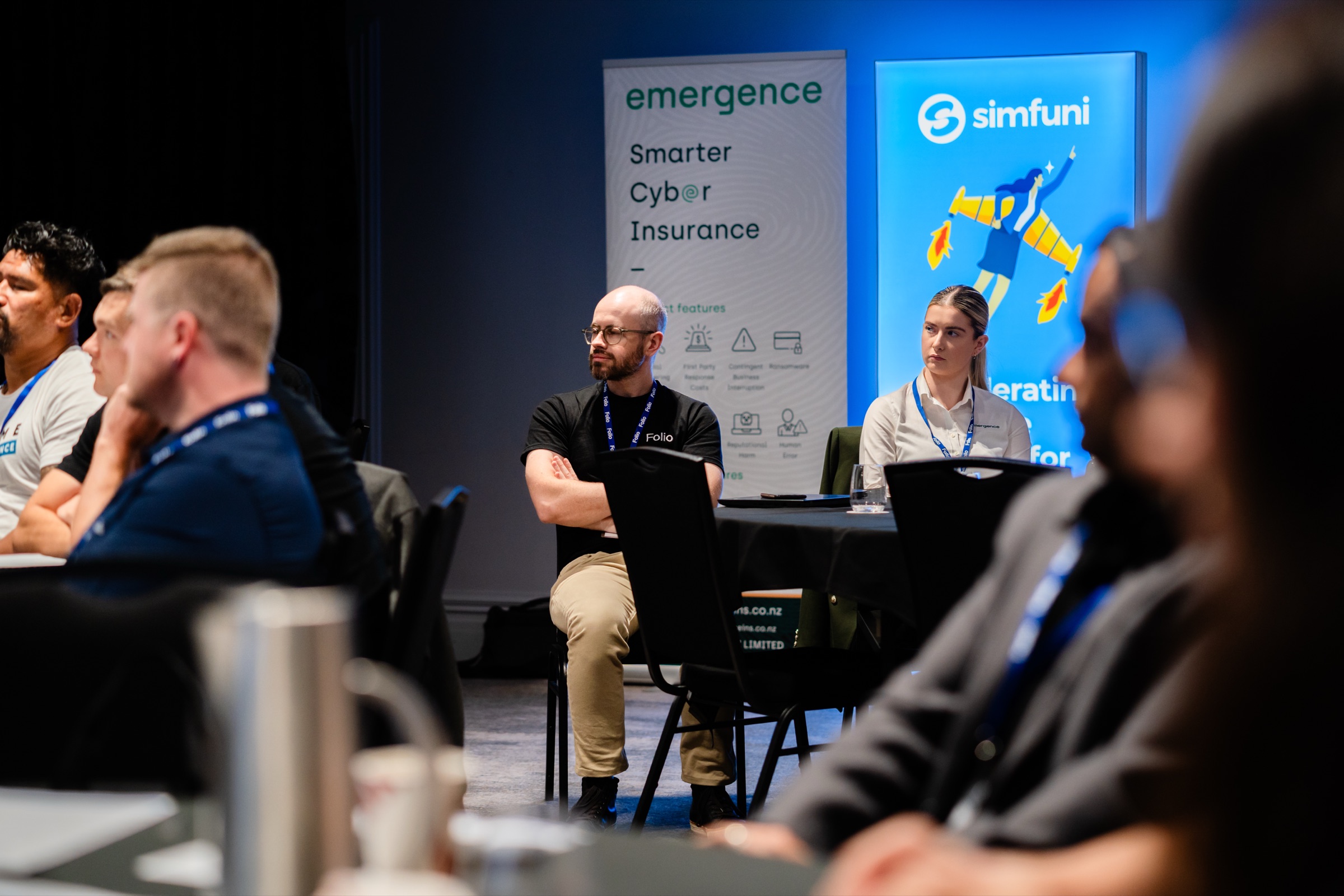 Folio team and brokers listening at an industry event