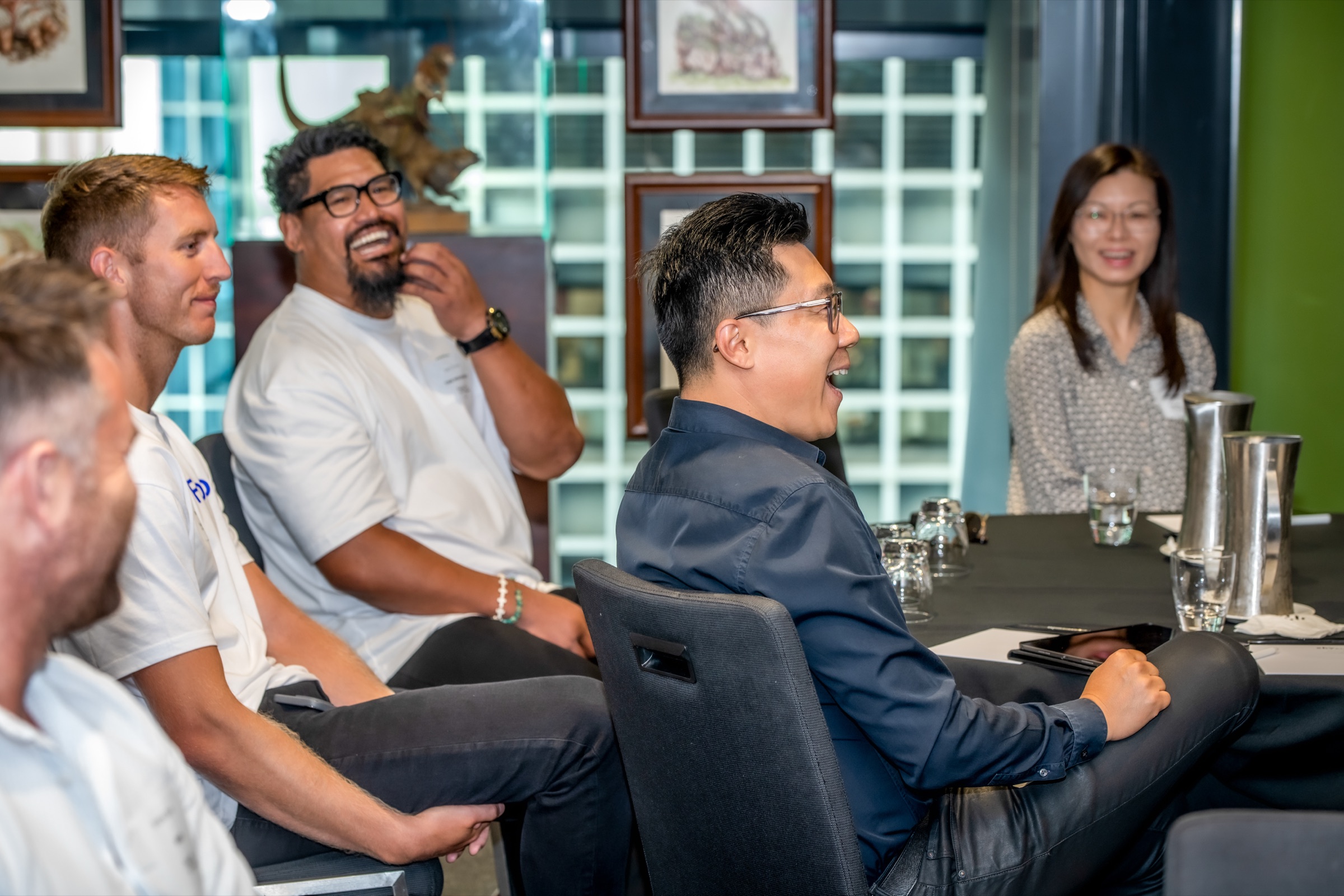 Brokers sharing a conversation around a table at the Folio summit
